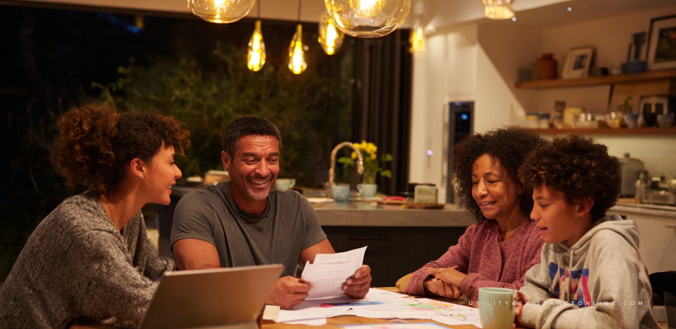 Houston family discussing electricity bill with energy company representative under warm indoor lighting