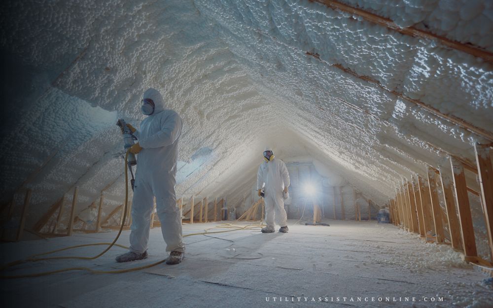 Professional spray foam insulation installation in a home wall cavity